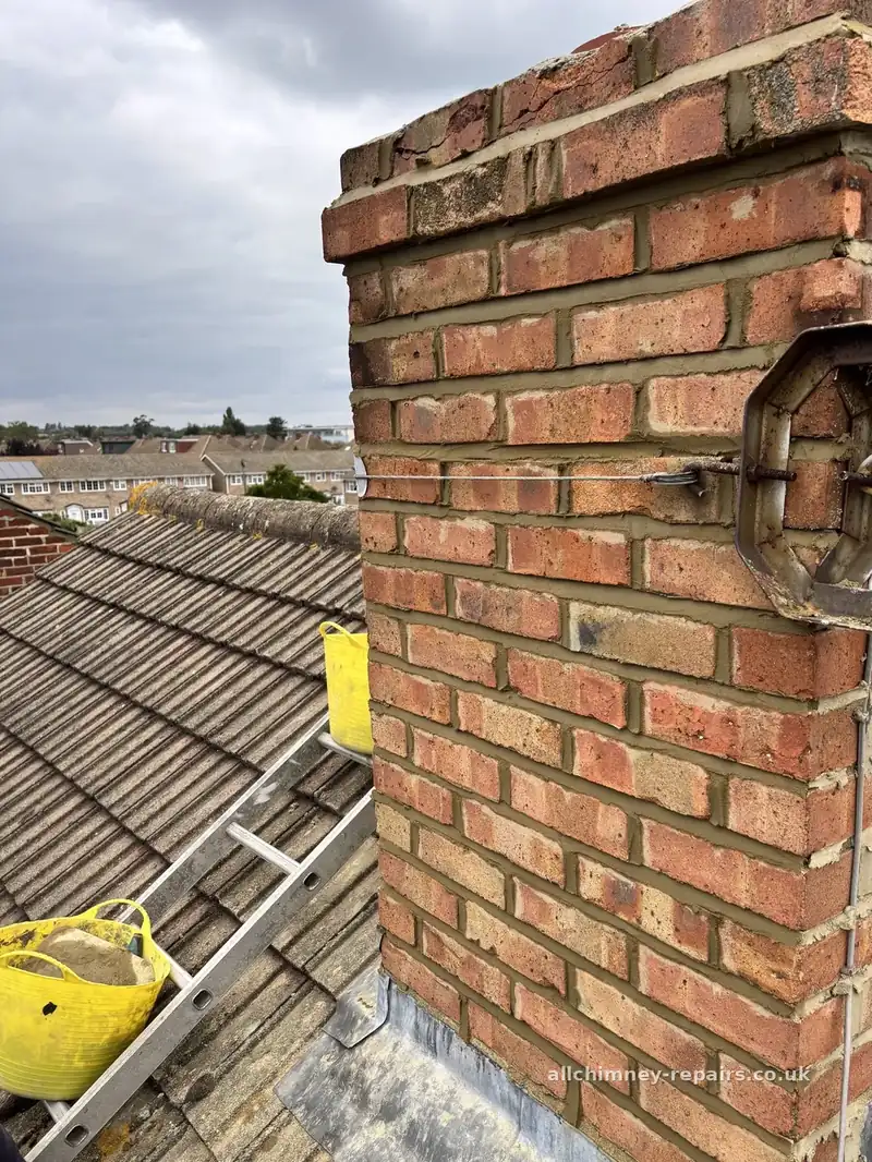 Chimney repair specialist — rake out and weather struck repoint on 1920s Fletton LBC brick stack, rope access, Rise Park Romford | Allchimney Repairs