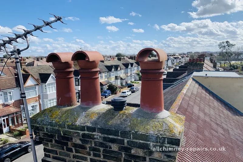 Chimney repair specialist — chimney pot bases sealed and flaunching repaired, ridge type vented cappings and gas louvred termination fitted, Rise Park Romford | Allchimney Repairs