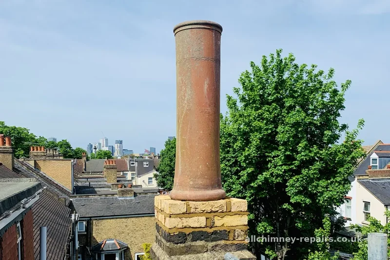 Chimney repair specialist — reclaimed 900mm chimney pot seated on relaid top course brickwork, tall lazy boy pot reduces downdraught on previously shortened stacks, Gidea Park Romford | Allchimney Repairs