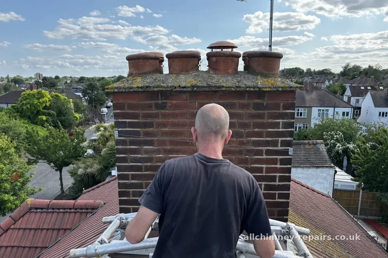 Chimney repair specialist — operative erecting bespoke aluminium ridge platform for chimney pot and flue repairs, scaffold-free safe access without erecting scaffolding, Collier Row Romford | Allchimney Repairs