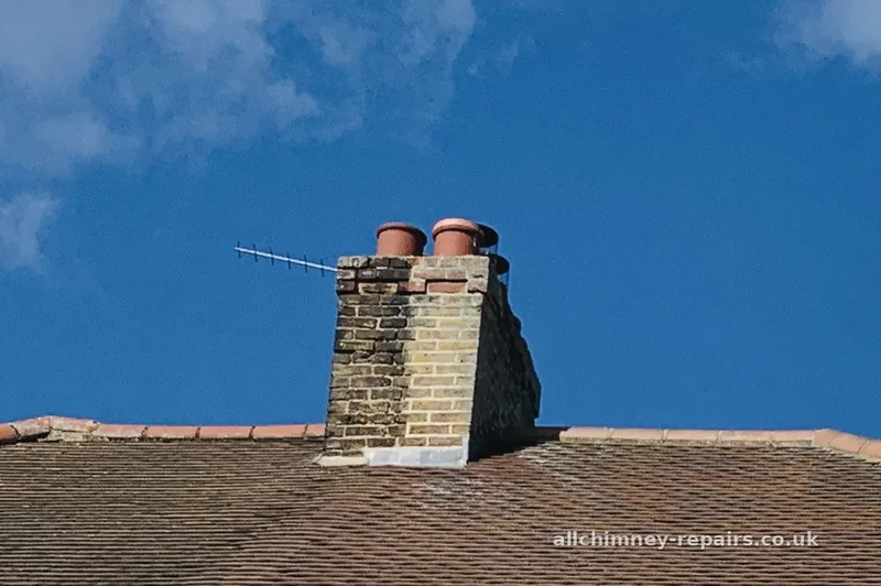 Chimney repair specialist — chimney brickwork moss cleaned, mortar raked out and repointed on shared chimney stack, Harold Wood | Allchimney Repairs