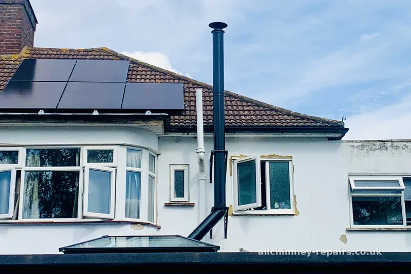 Chimney repair specialist — twin wall insulated external flue system inspected for freestanding stove in ground floor extension, inadequate bracketing investigated, condition report produced, Romford | Allchimney Repairs