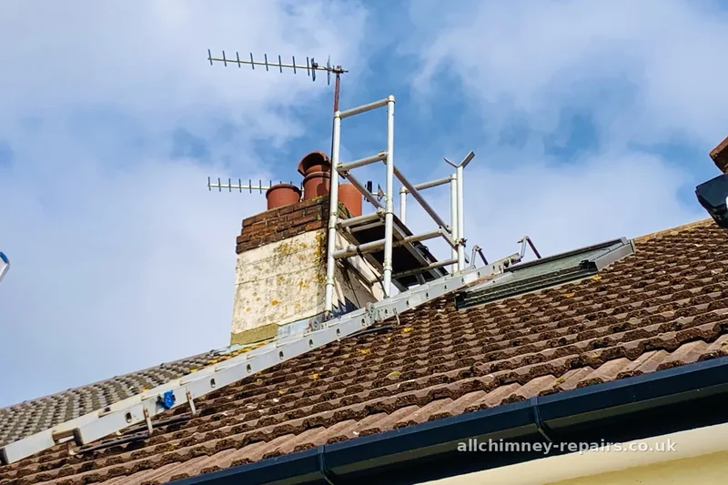 Chimney repair specialist — chimney crack repairs and spalling render repaired using ridge platform, loose debris had been falling onto the drive, Romford | Allchimney Repairs