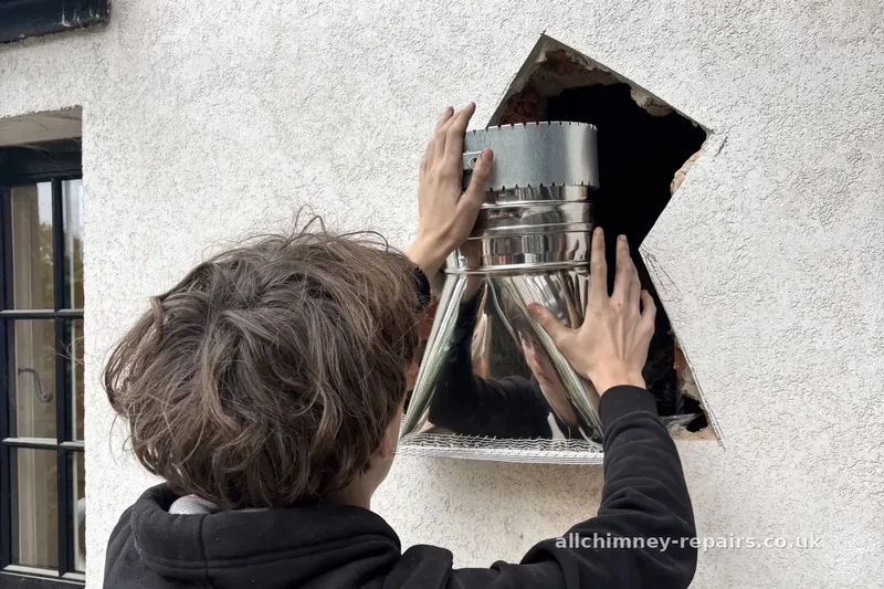 HETAS registered chimney lining — solid fuel open fire gather unit installed via external wall opening, all builder's work outside the property, HETAS certificate issued on completion, Hornchurch | Allchimney Repairs